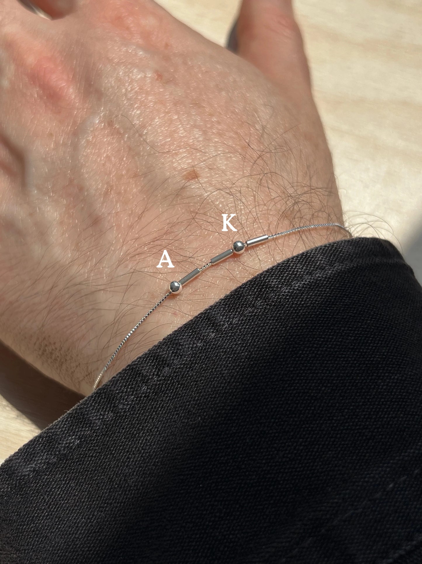 Woman wearing custom morse code bracelet as gift talisman
